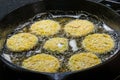 Slices of green tomato being fried Royalty Free Stock Photo