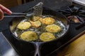 Slices of green tomato being fried Royalty Free Stock Photo