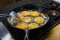 Slices of green tomato being fried Royalty Free Stock Photo