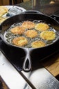 Slices of green tomato being fried Royalty Free Stock Photo