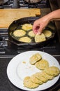 Slices of green tomato being fried Royalty Free Stock Photo