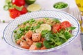 Slices of grilled salmon, quinoa, green peas, tomato, lime and lettuce leaves Royalty Free Stock Photo