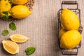 Slices, half fresh juicy lemon with mint leaves. Top view with copy space. Royalty Free Stock Photo