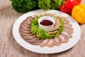 Slices of ham, sausages and salami decorated on plate for event Royalty Free Stock Photo