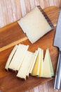 Slices of hard cheese Anejo from sheep milk