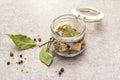 Slices of herring with spices in a glass jar Royalty Free Stock Photo
