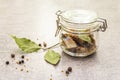 Slices of herring with spices in a glass jar Royalty Free Stock Photo