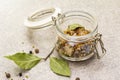 Slices of herring with spices in a glass jar Royalty Free Stock Photo