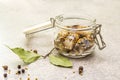 Slices of herring with spices in a glass jar Royalty Free Stock Photo