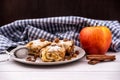 Slices of homemade Apple pie strudel in a plate on a wooden table Royalty Free Stock Photo