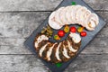 Slices of Homemade meatloaf, veal and pork tenderloin stuffed with vegetables on black slate stone chalkboard Royalty Free Stock Photo