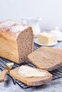 Slices of homemade no knead sandwich bread with butter, on cooling rack, vertical Royalty Free Stock Photo