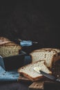 Slices of homemade white bread with jam on a wooden slat