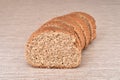 Slices of homemade wholegrain unleavened brown bread on the table Royalty Free Stock Photo