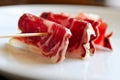 A slices of jamon, strung on a skewer Royalty Free Stock Photo