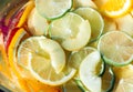 Slices of lemon, orange, lime, strawberry and peach in lemonade Royalty Free Stock Photo