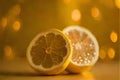 Slices of lemon on a yellow background with bokeh