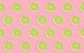 Slices of limes on pink background, flat lay Royalty Free Stock Photo