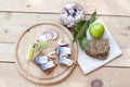 Slices of marinated mackerel with onion in a jar, lime, laurel and bread on wooden board Royalty Free Stock Photo