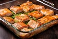 slices of marinated pork belly in an ovenproof dish Royalty Free Stock Photo