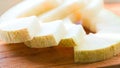 Slices of melon close-up lying on a wooden board Royalty Free Stock Photo