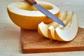Slices melon knife cutting board Royalty Free Stock Photo