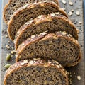 Slices of multigrain bread are arranged on a rustic wooden surface. The bread is Royalty Free Stock Photo
