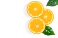 Slices of orange fruit and green leaves isolated on white background Royalty Free Stock Photo