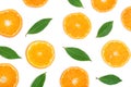 Slices of orange or tangerine with leaves isolated on white background. Flat lay, top view. Fruit composition Royalty Free Stock Photo