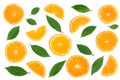 Slices of orange or tangerine with leaves isolated on white background. Flat lay, top view. Fruit composition Royalty Free Stock Photo