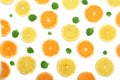 Slices of orange or tangerine and lemon with mint leaves isolated on white background. Flat lay, top view Royalty Free Stock Photo