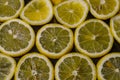 Slices of organic Sicilian lemon arranged on a glittered black glass background Royalty Free Stock Photo