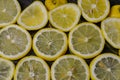 Slices of organic Sicilian lemon arranged on a glittered black glass background Royalty Free Stock Photo