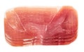 Slices of parma ham prosciutto isolated on white background. Slice of a prosciutto ham isolated Royalty Free Stock Photo