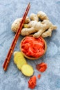 Slices of pickled ginger and fresh ginger root. Royalty Free Stock Photo