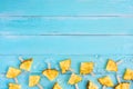 Slices pineapple popsicle sticks with ice on wood plank blue color. Royalty Free Stock Photo