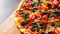 Pizza with Mozzarella cheese, salami, pepper, pepperoni, Tomatoes, olives, Spices and Fresh Basil. Italian pizza Royalty Free Stock Photo