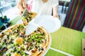 slices of pizza. Table with pizza in a restaurant. Pizza close up on a green