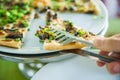 slices of pizza. Table with pizza in a restaurant. Pizza close up on a green