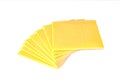 Slices of processed cheese on a white background. Royalty Free Stock Photo