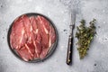 Slices of prsut, Balkan pork meat ham. grey background. top view Royalty Free Stock Photo
