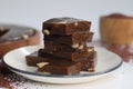 Slices of Ragi Halwa served in a round wooden tray