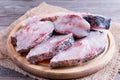 Slices of raw fresh fish on a cutting board Royalty Free Stock Photo