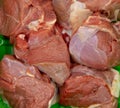 slices of raw meat as a backdrop.