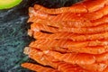 Slices of raw salmon on marble background