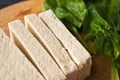 Slices of raw tofu and spinach Royalty Free Stock Photo