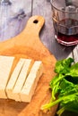 Slices of raw tofu, spinach and wine Royalty Free Stock Photo