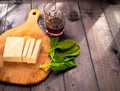 Slices of raw tofu, spinach and wine Royalty Free Stock Photo