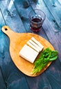 Slices of raw tofu, spinach and wine Royalty Free Stock Photo