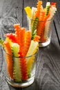 Slices of raw vegetables in glasses